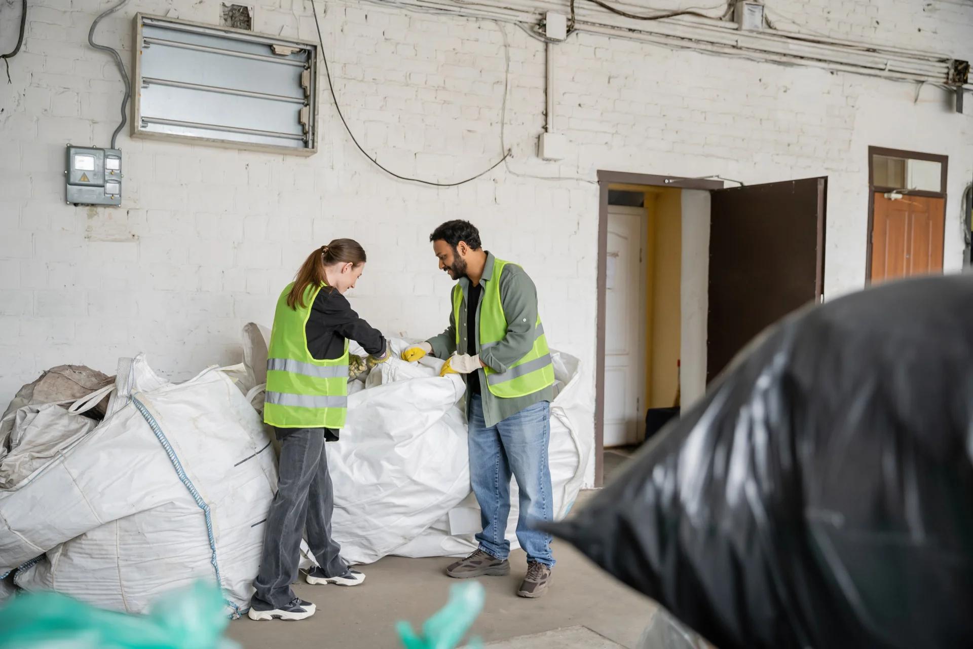 side-view-of-young-worker-in-high-visibility-vest